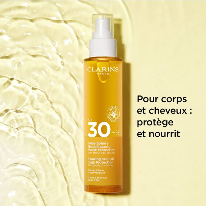 Plan produit sur fond texturé de l’huile solaire en spray 30+ pour les cheveux et le corps avec du texte sur ses effets protecteurs et nourrissants